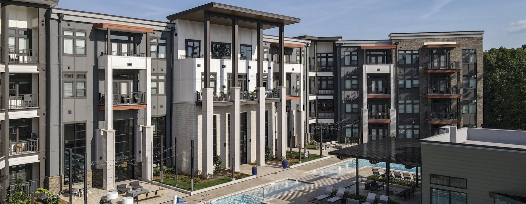 a large building with a pool